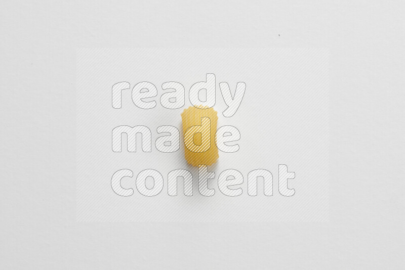 Elbow pasta on white background