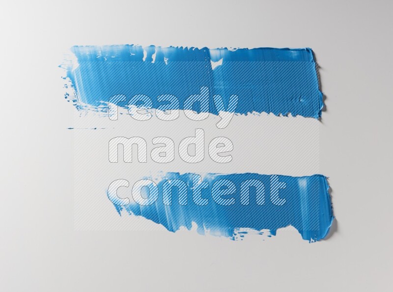 Blue painting knife strokes on white background