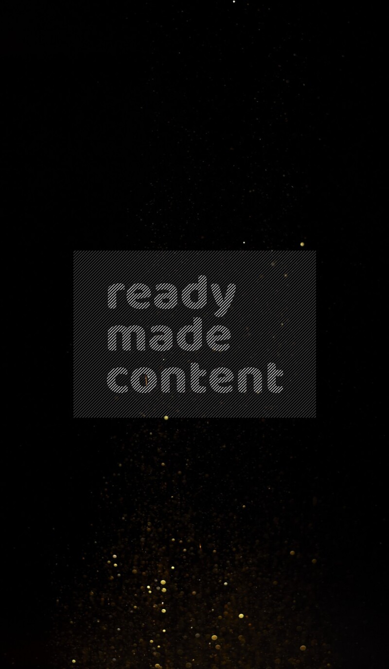 Gold glitter powder isolated on black background