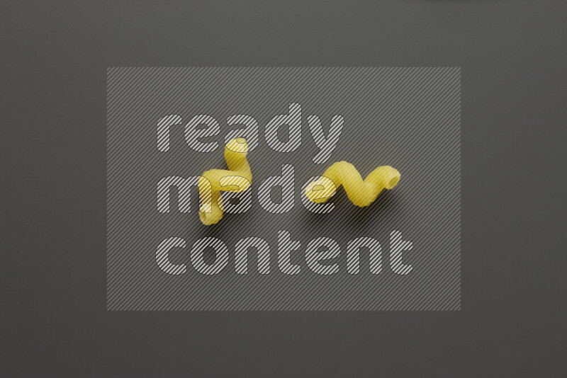 Twist pasta on grey background