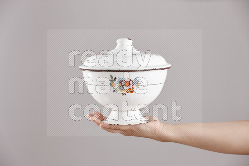 Woman hands holding different metal essentials in different positions