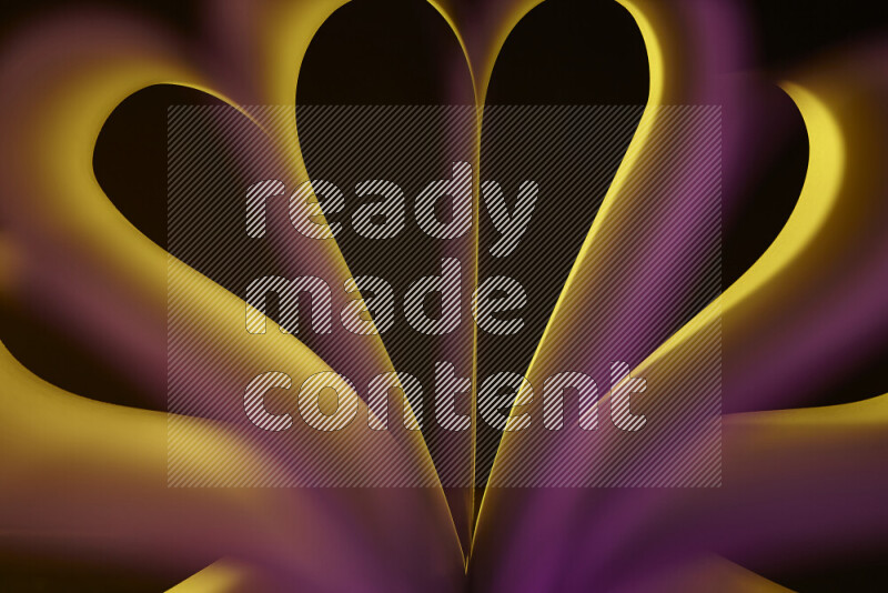 فن تجريدي يعرض منحنيات وتدرجات اللون الأصفر والوردي مكونه بضوء ملون