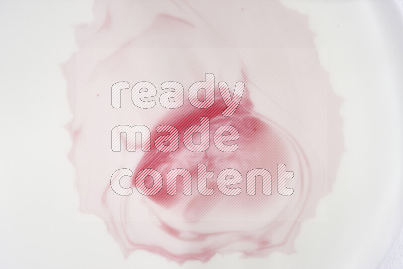 A close-up of abstract swirling patterns in red and white