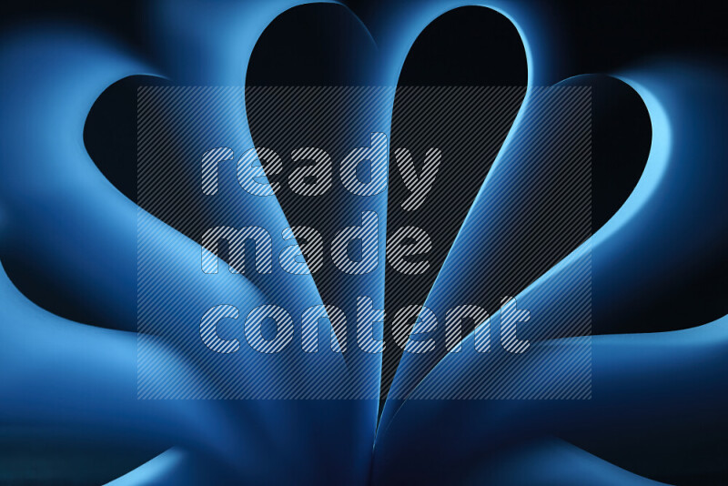 An abstract art piece displaying smooth curves in blue gradients created by colored light