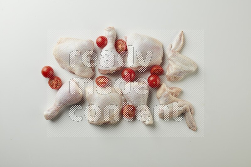 Mixed fresh chicken pieces direct on a white background