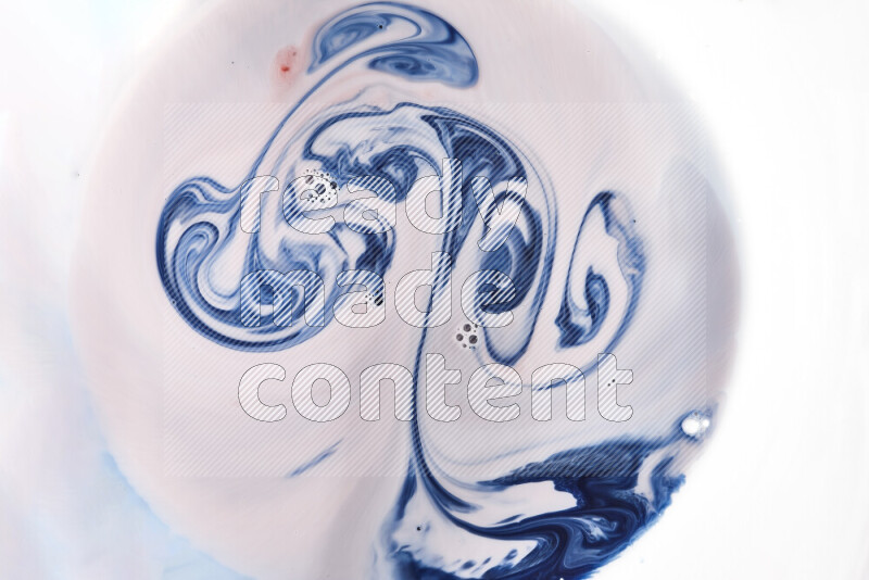 A close-up of abstract swirling patterns in blue, red and white
