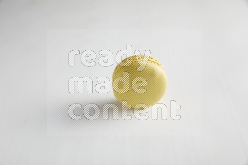 45º Shot of Yellow Lime macaron on white background
