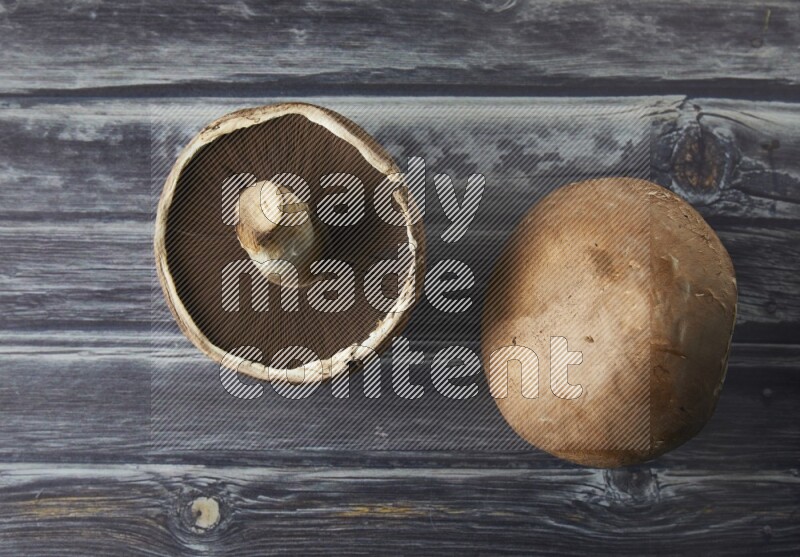 Fresh portobello mushroom topview on a grey wooden textured