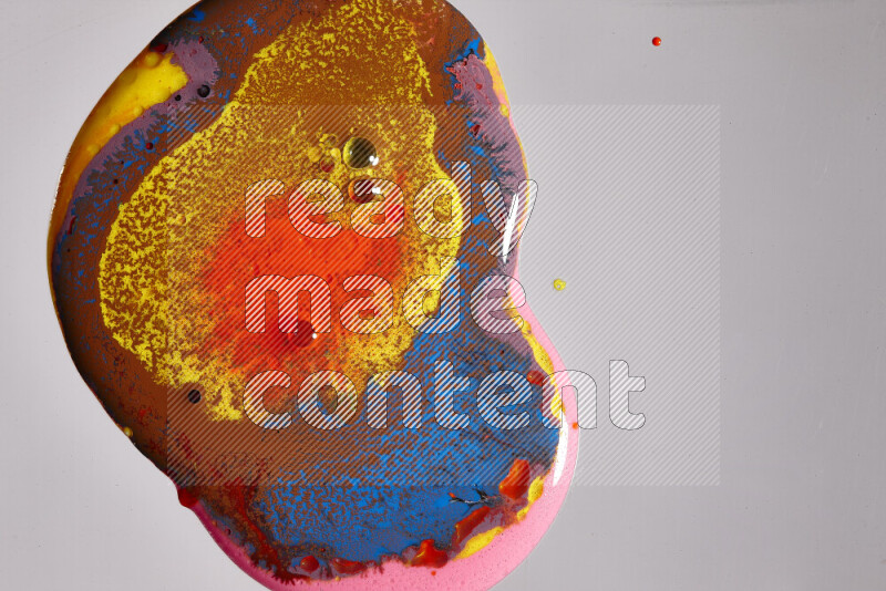 Close-ups of assorted colors blending on a grey background