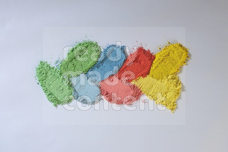 Multicolored powder smears on white background