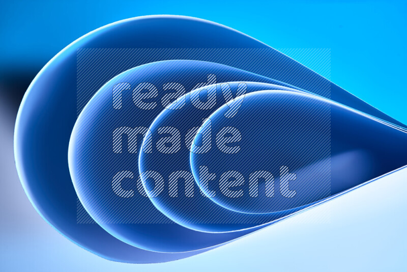 An abstract art of paper folded into smooth curves in blue gradients