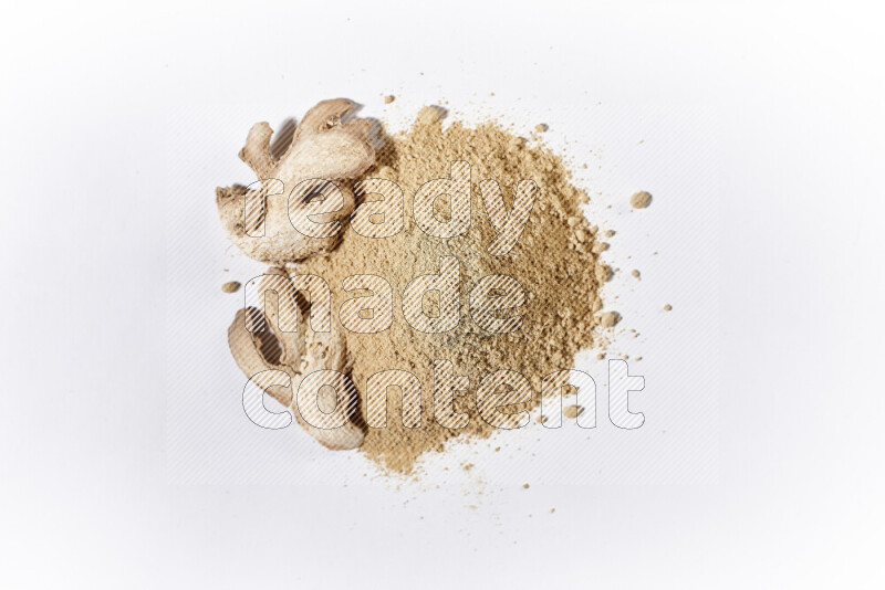 A bunch of ground ginger powder on white background