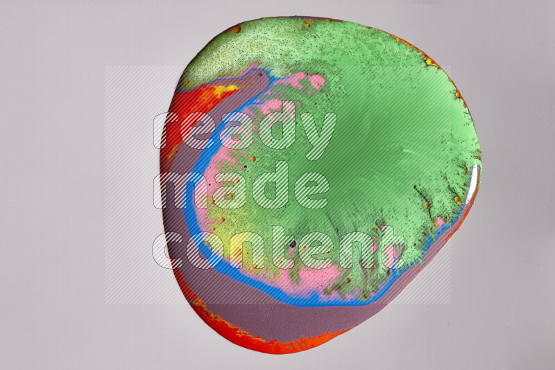 Close-ups of assorted colors blending on a grey background