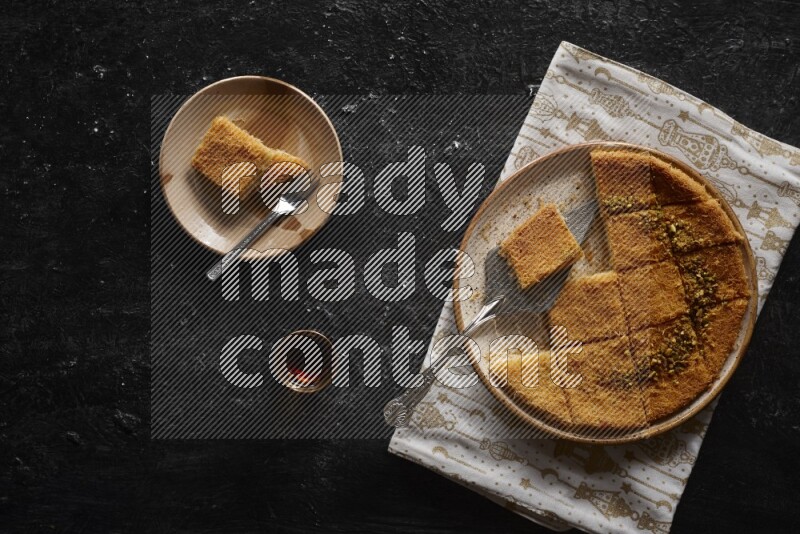 konafa with tea in a dark setup