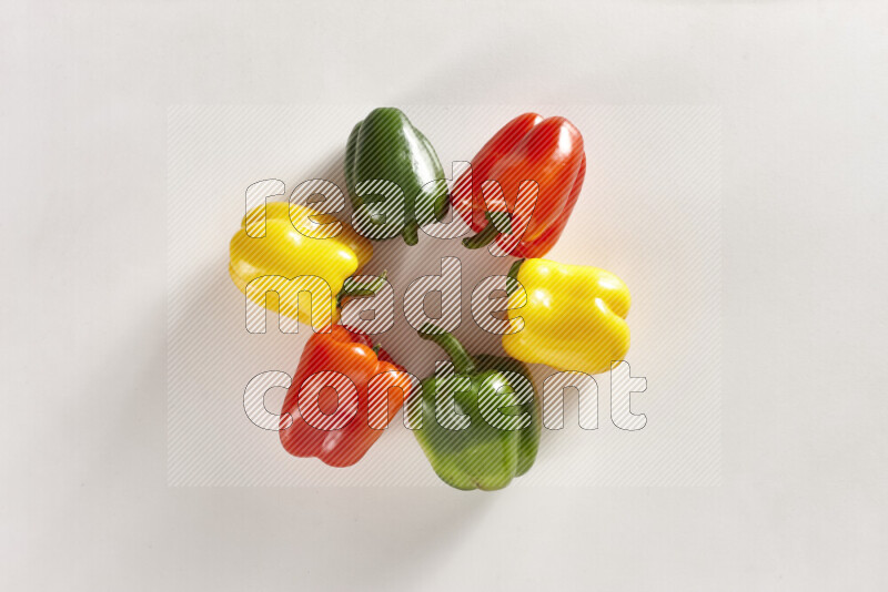 Assorted bell peppers on white background