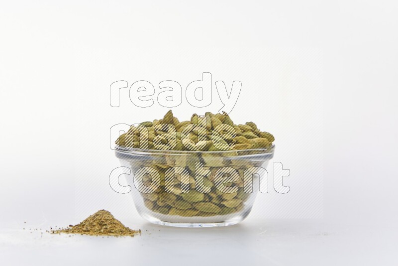 Cardamon in a container on white background