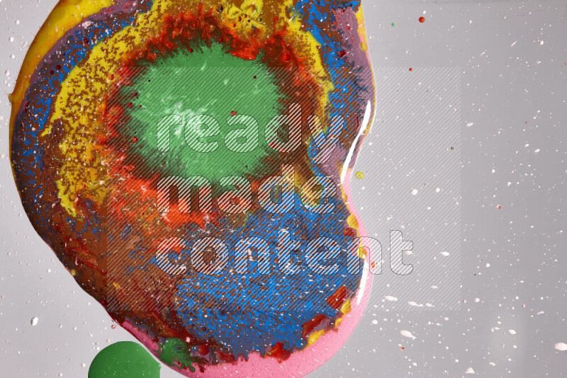 Close-ups of assorted colors blending on a grey background