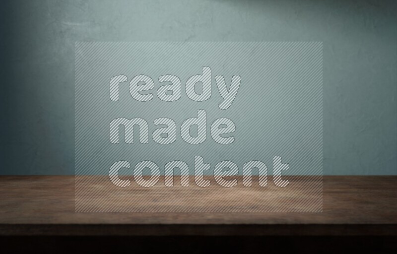 A wooden table top with colored textured wall background