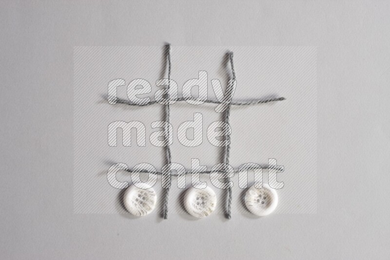 White buttons placed on grey background