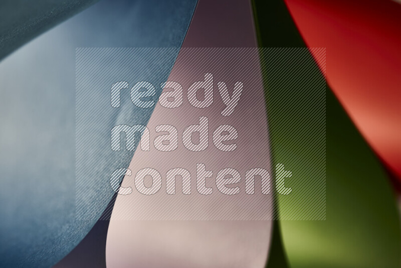 An abstract art showing colorful paper sheets arranged in an overlapping curves