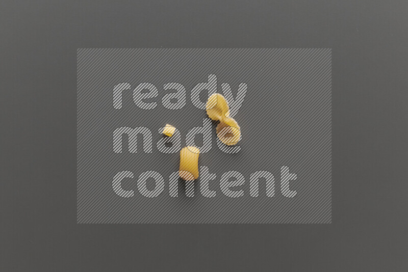 Different pasta types on grey background