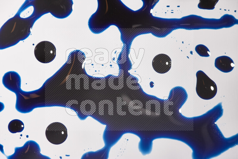 Close-ups of abstract blue paint droplets on the surface