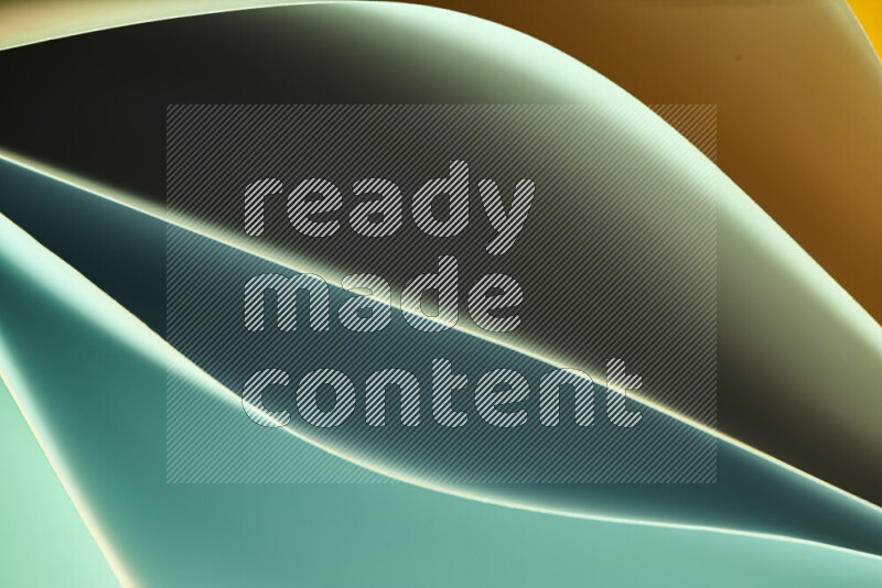 This image showcases an abstract paper art composition with paper curves in green and orange gradients created by colored light