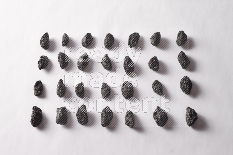 Dried plums on white background