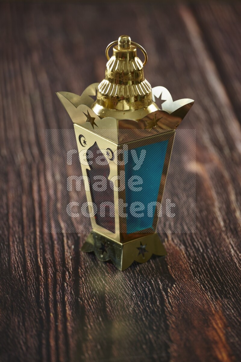 A lantern placed on a wooden background