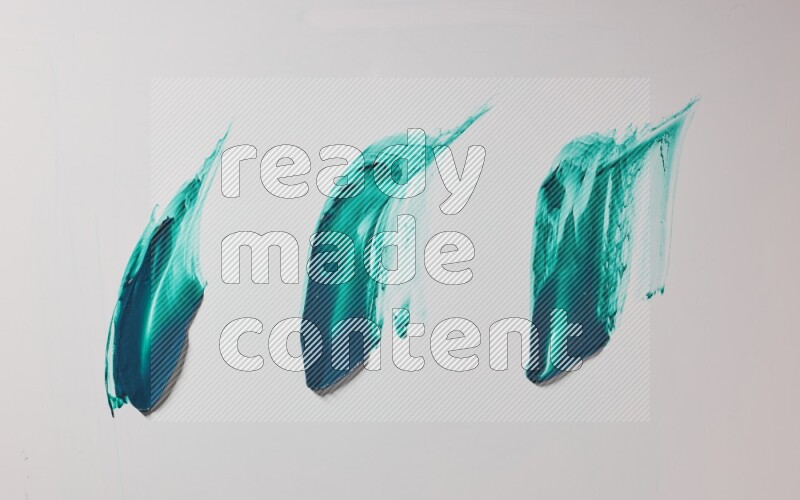 Turquoise painting knife strokes on white background
