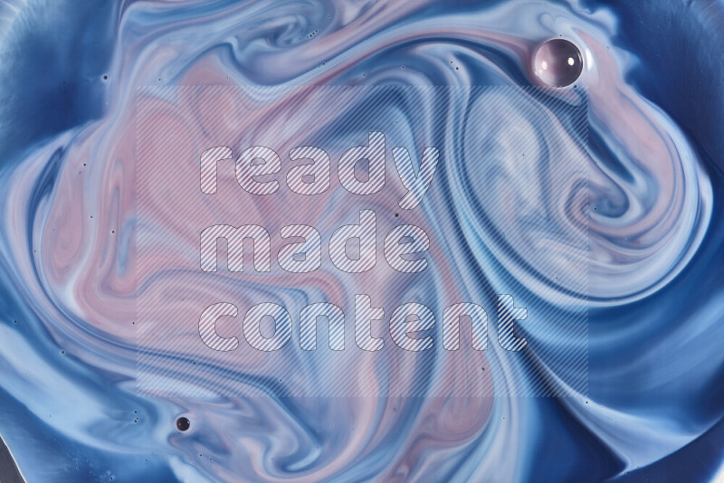 لقطة مقربة لأنماط دوامية باللون الأزرق والأحمر والأبيض