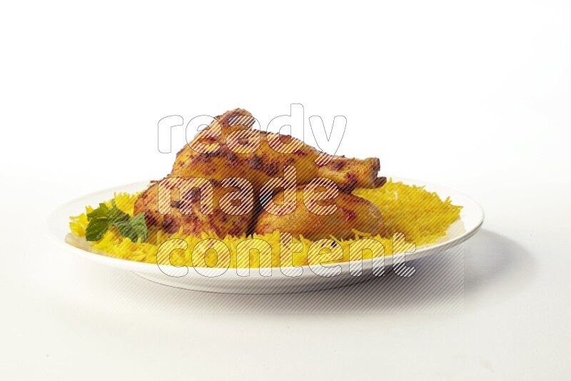 yellow basmati Rice with kabsa chicken pieces on a white rounded plate direct on white background