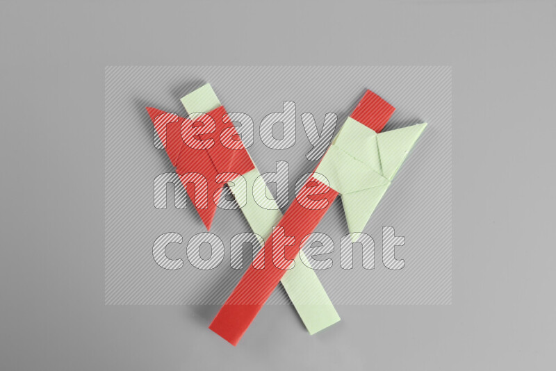 Origami axe on grey background
