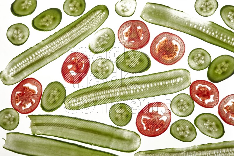 Mixed vegetables slices on illuminated white background