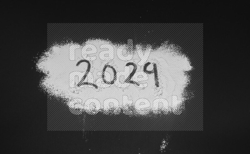 Numbers written with powder on black background