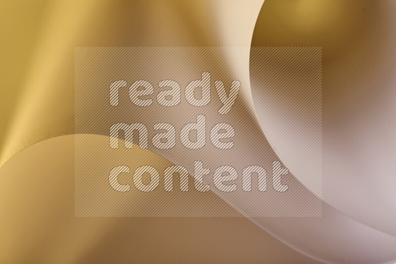 فن تجريدي يعرض منحنيات وتدرجات اللون الذهبي مكونه بضوء ملون