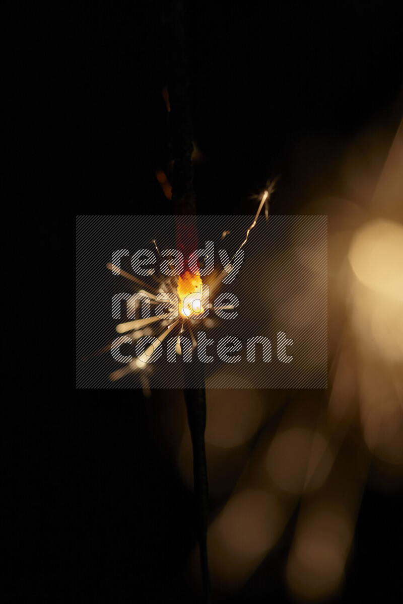 A close-up image of sparkler candle isolated on black background