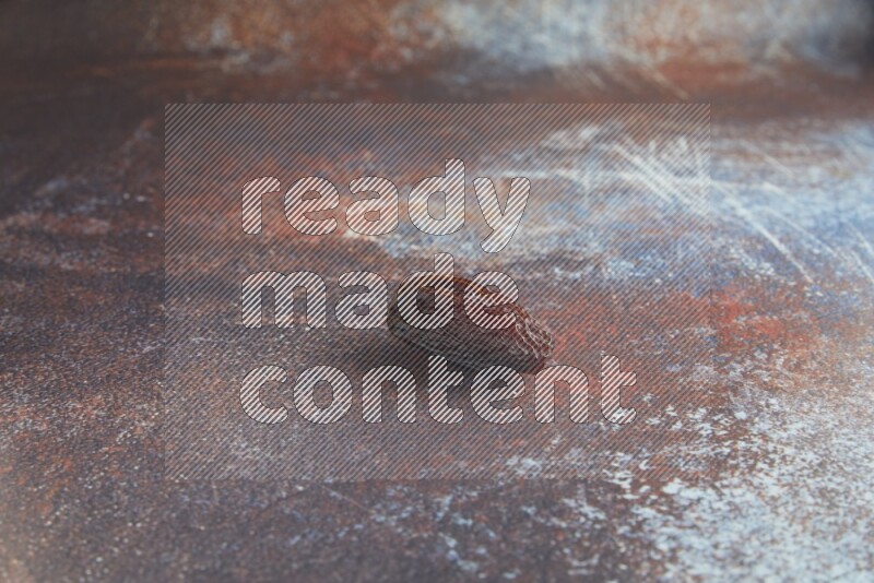 one madjoul date on a rustic reddish background