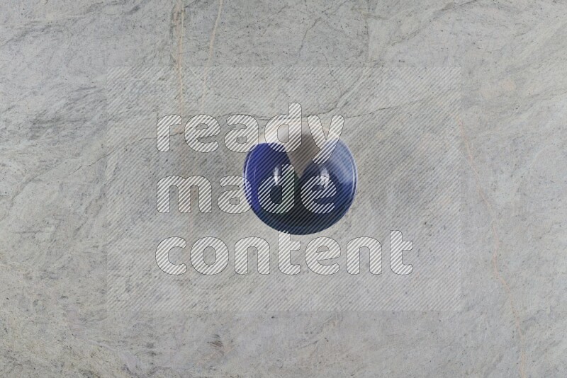 A multicolored pottery Bowl on grey marble background