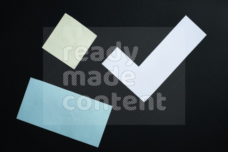Multicolored paper sheet on black background