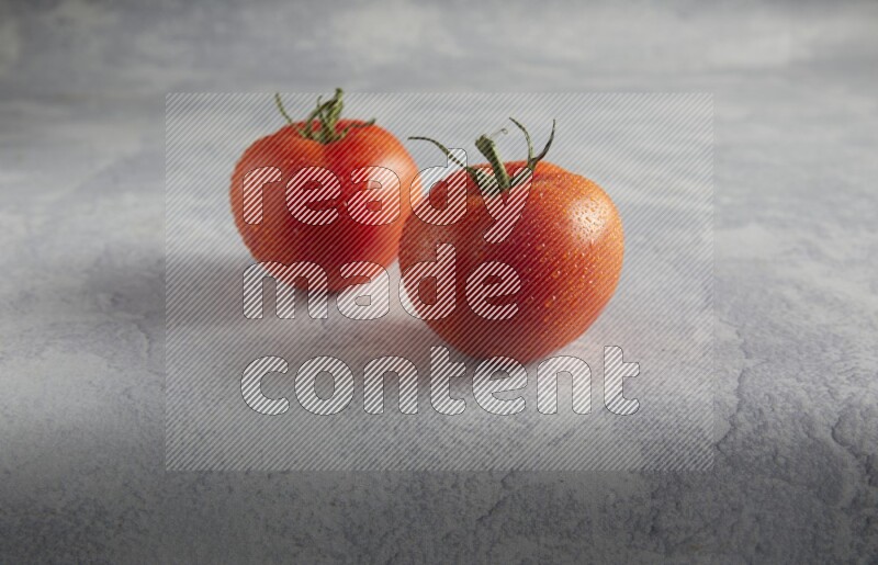 45 degree roma tomato on a textured light blue background