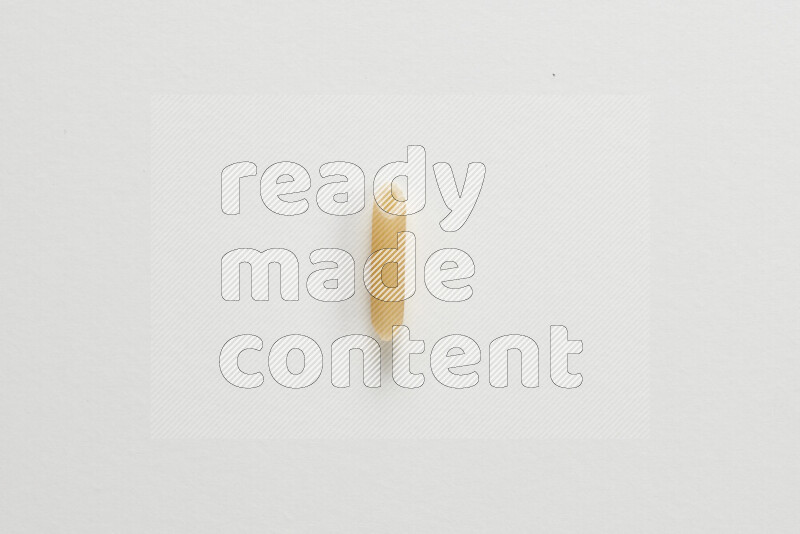 Mini penne pasta on white background