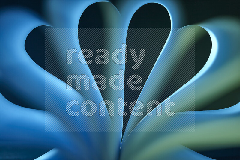 فن تجريدي يعرض منحنيات وتدرجات اللون الأزرق والأخضر مكونه بضوء ملون