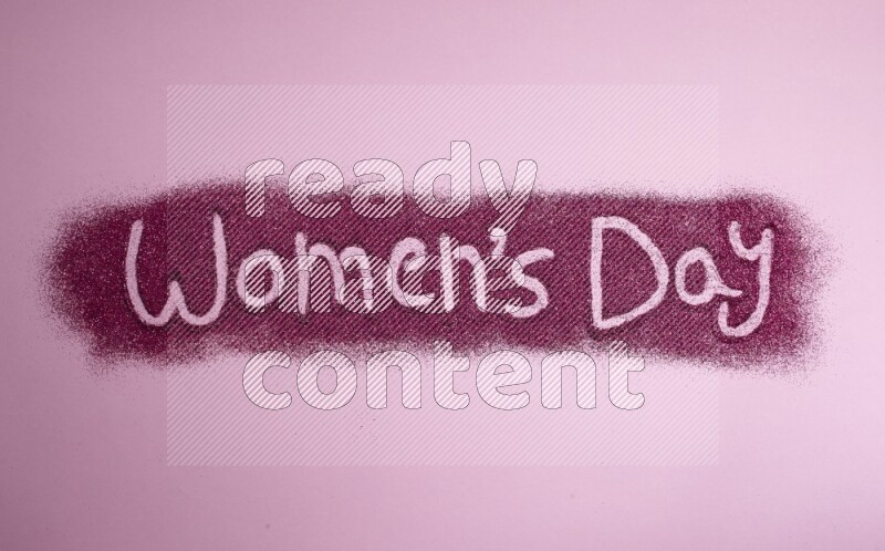 A sentence written with pink glitter on pink background