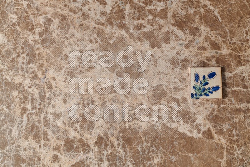 A decorative coaster on beige marble background