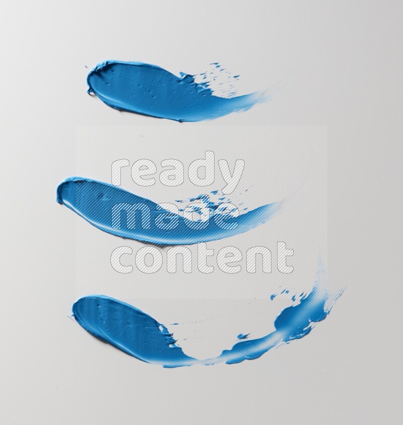 Blue painting knife strokes on white background