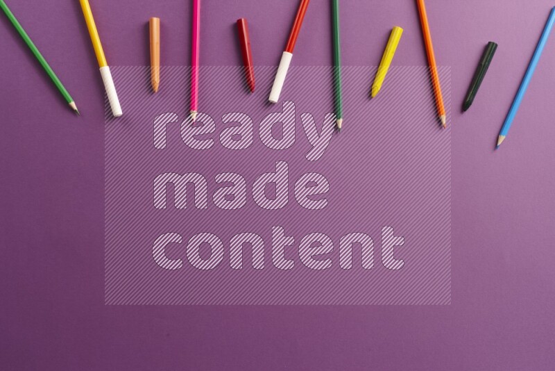 Different school supplies on purple background