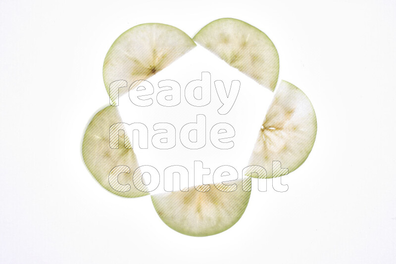 Apple slices on illuminated white background