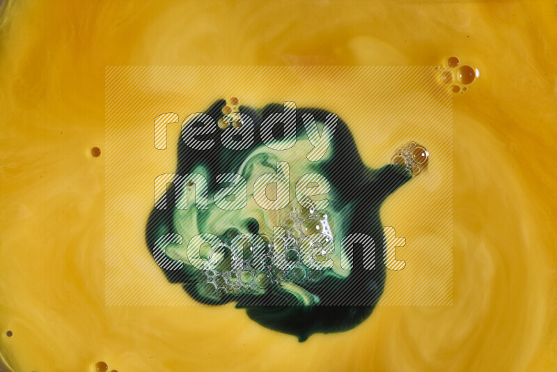 A close-up of abstract swirling patterns in orange and green