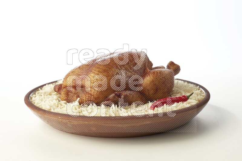 white  basmati Rice with  whole roasted chicken    on a pottery plate  direct  on white background